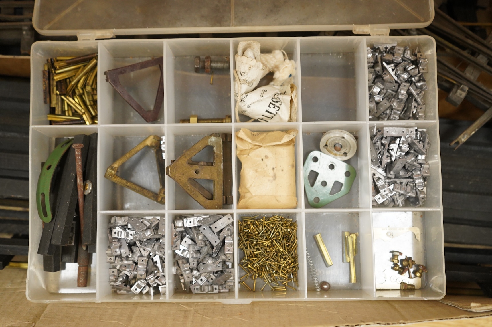 A quantity of 1930s-50s Bassett Lowke 0 gauge railway related track parts and accessories, including track sections on wooden sleepers, a Bassett-Lowke set of points, plus two handmade sets of points, track gauges, chair